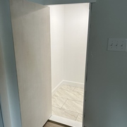 Hidden finished understairs storage space